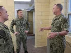 Master Chief Petty Officer of the Navy (MCPON) John Perryman, right, tours the King Hall officer candidate dormitory