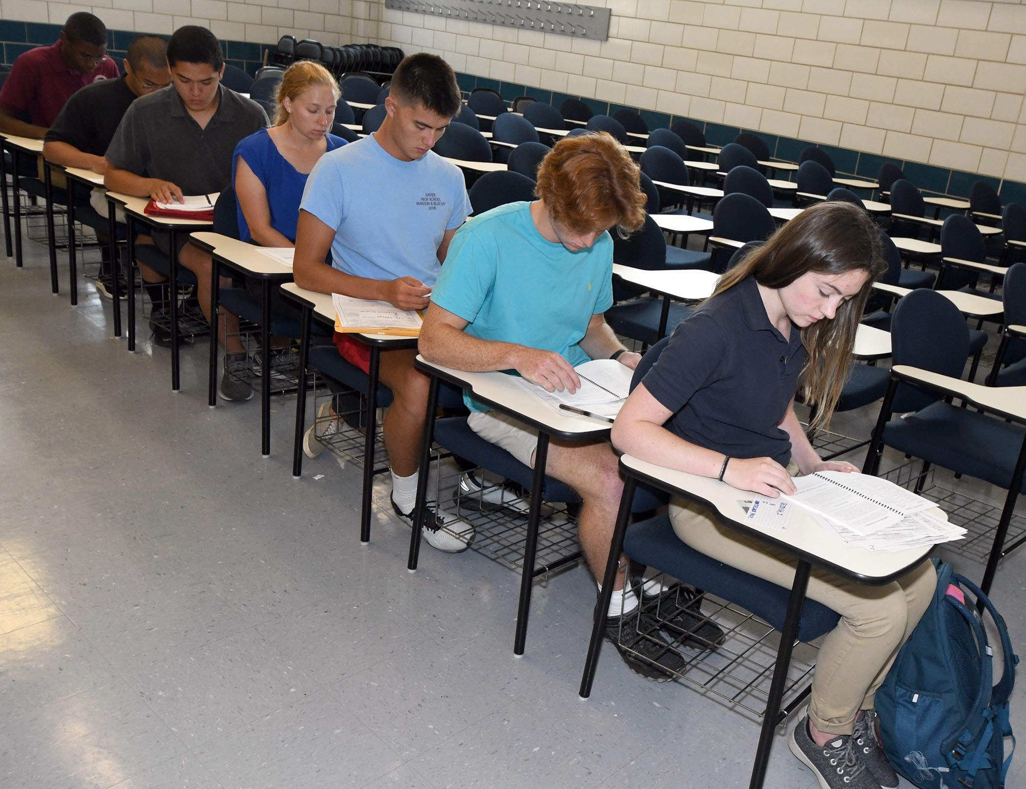 Candidates studying the Bravo handbook