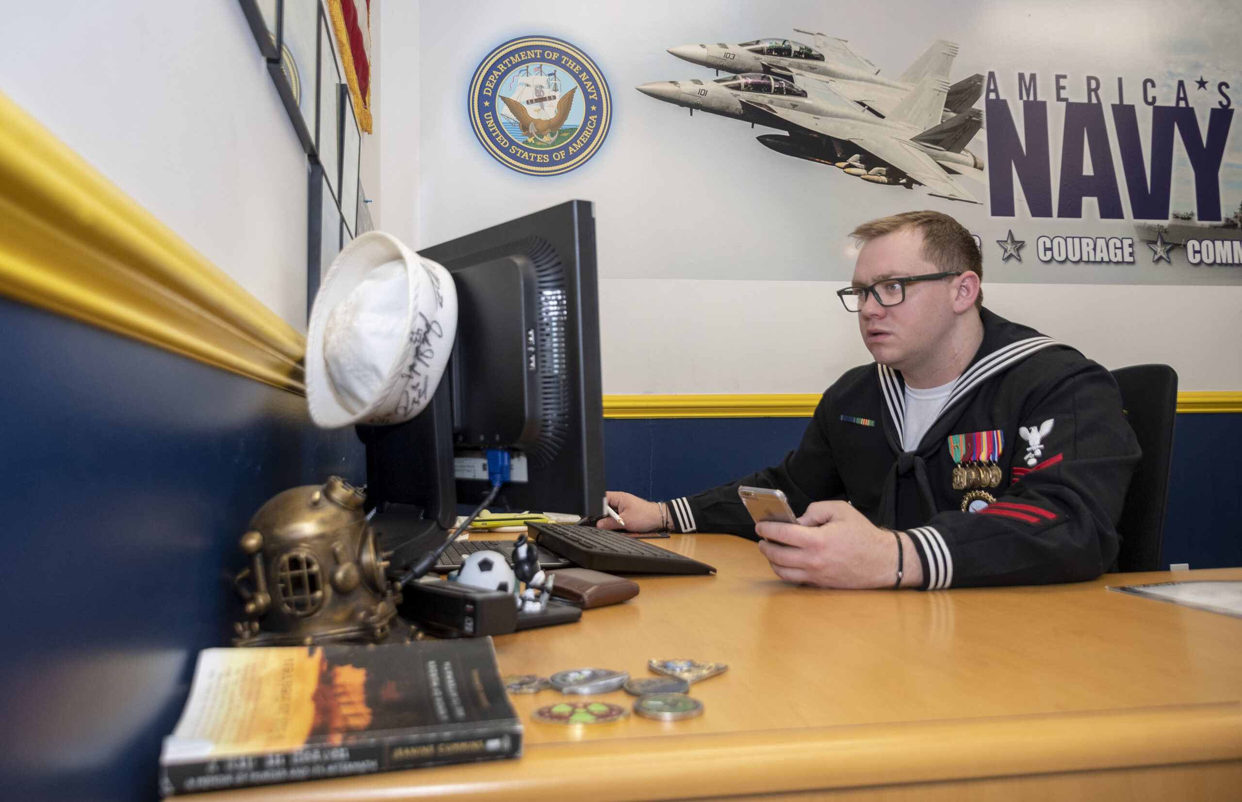 A Navy officer recruiter working at an NTAG office