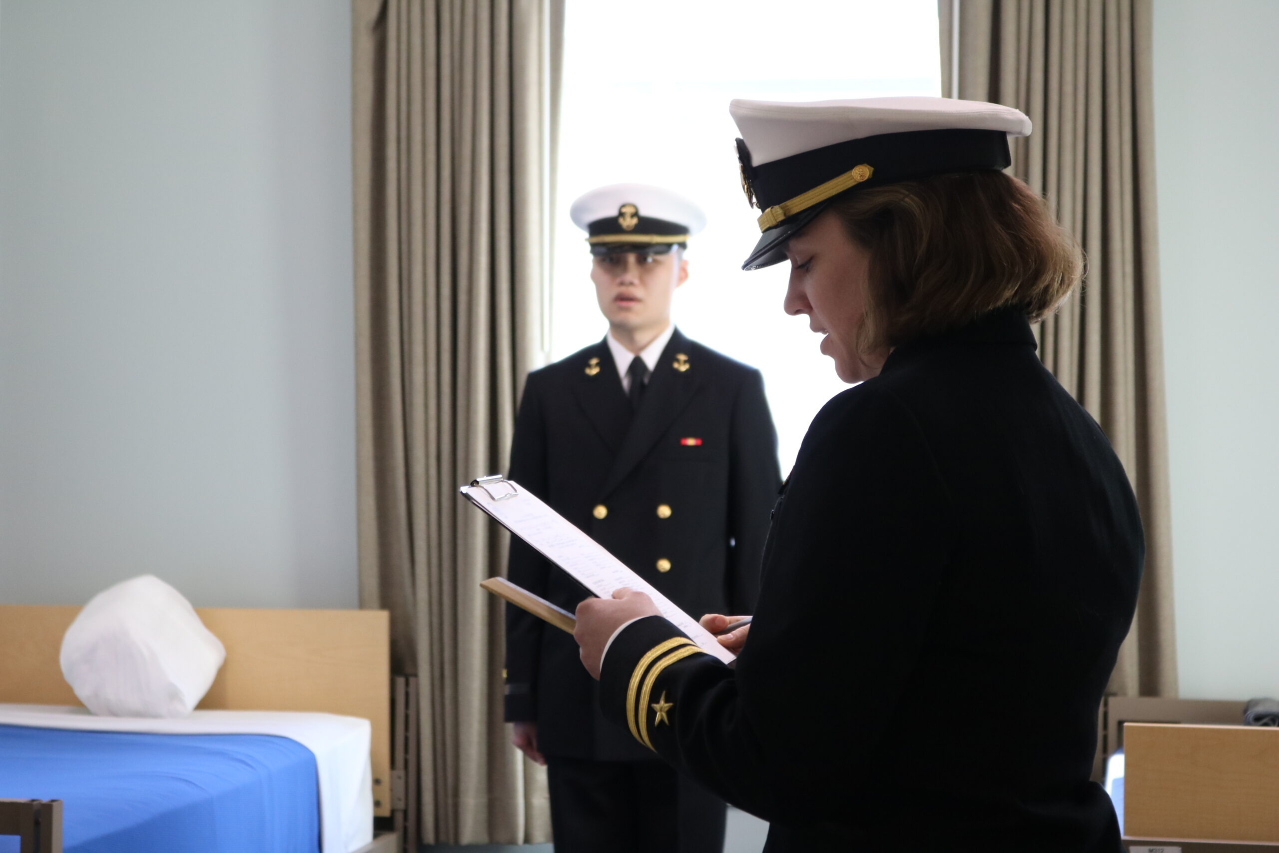 A Navy officer candidate in ODU uniform, smiling and confident