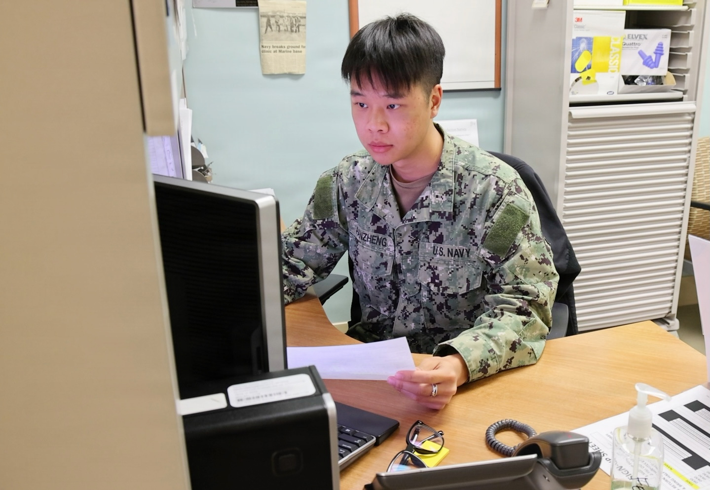 Medical officer reviewing a candidate's asthma waiver paperwork