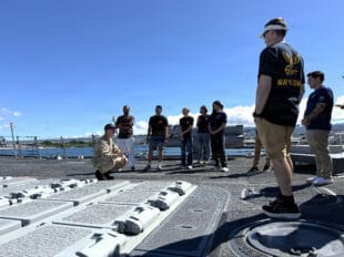 green card holder navy enlistment — U.S. Navy photo (DVIDS)