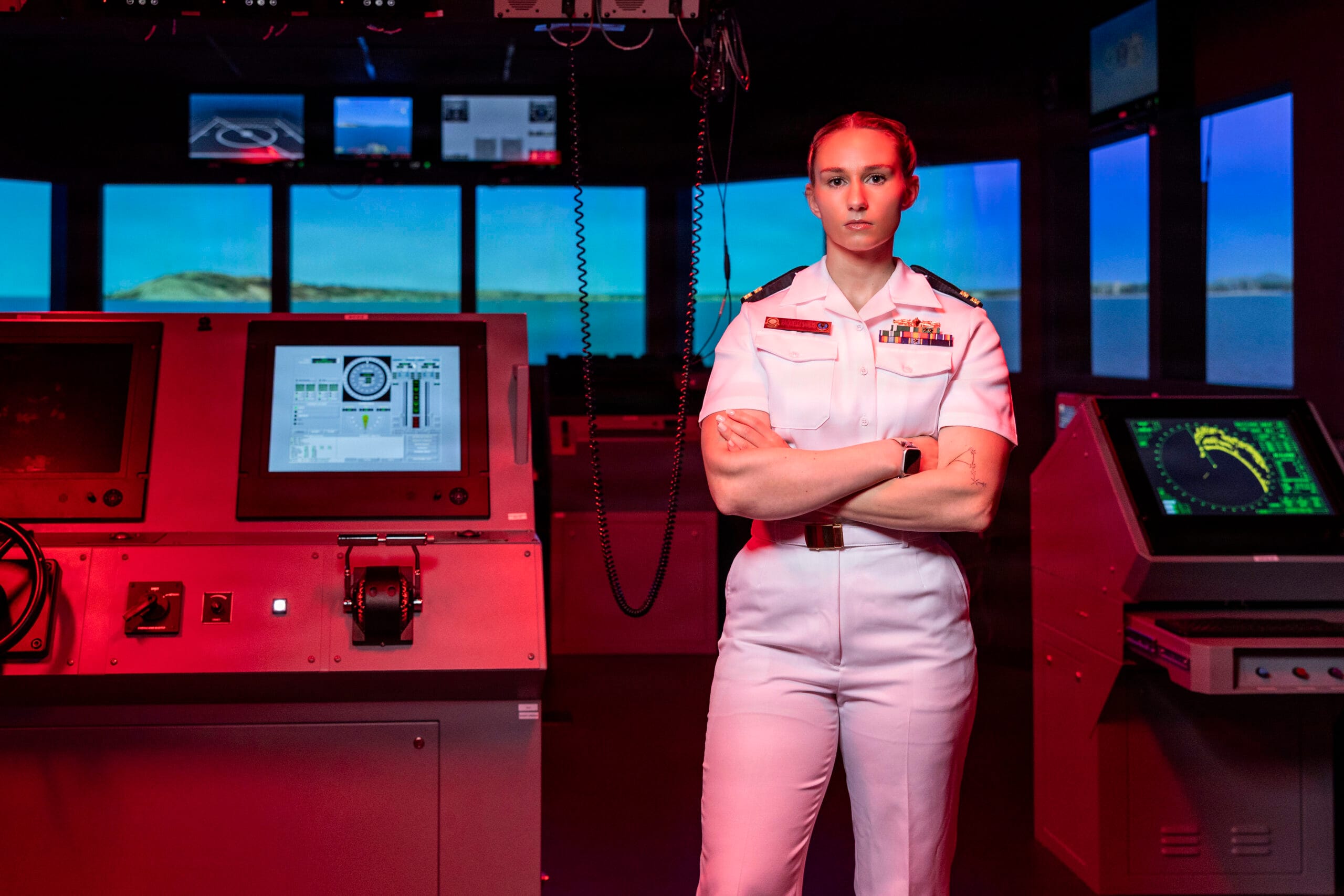 A Navy officer in dress blues, representing the goal after OCS
