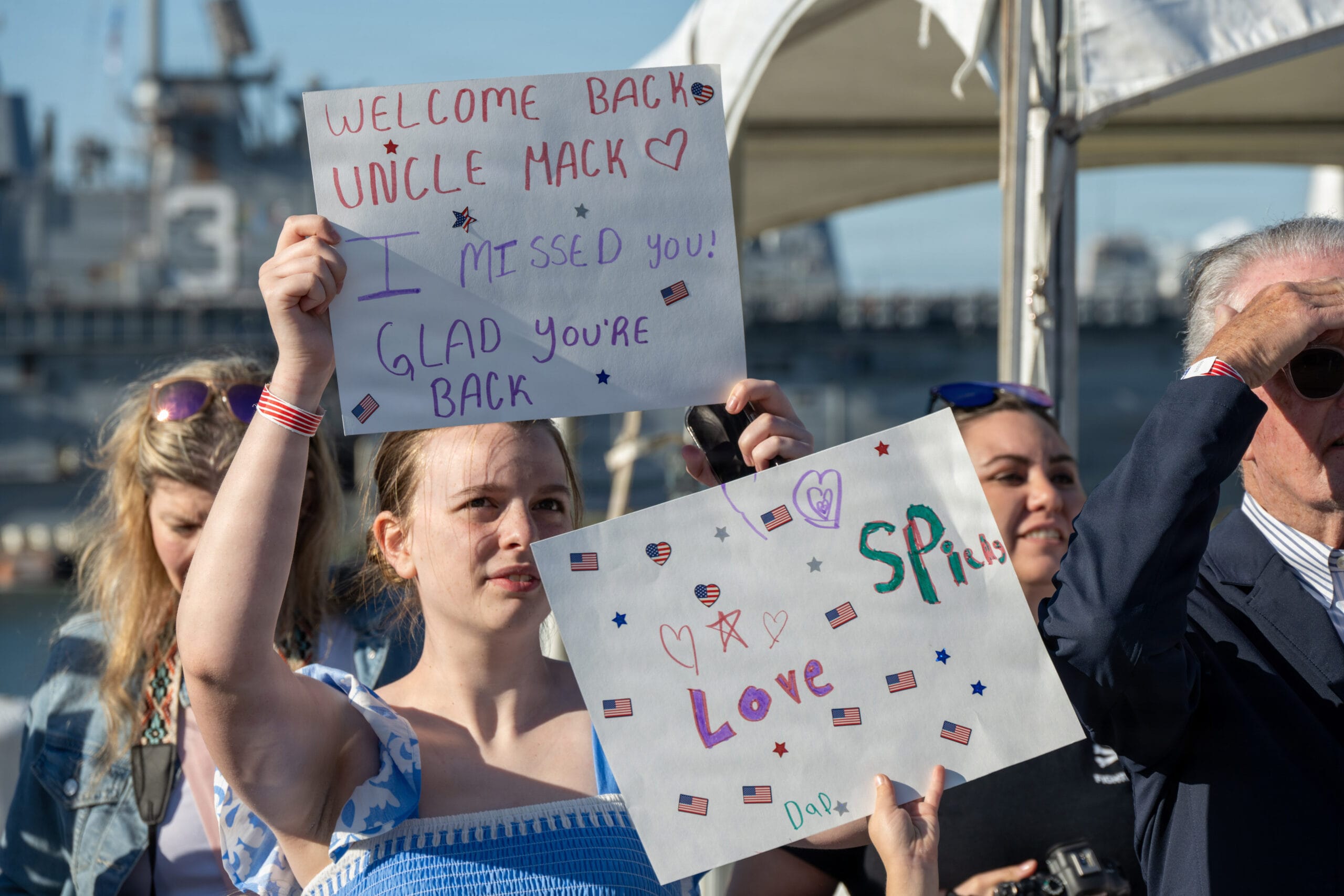 A sailor reunited with husband and children after deployment