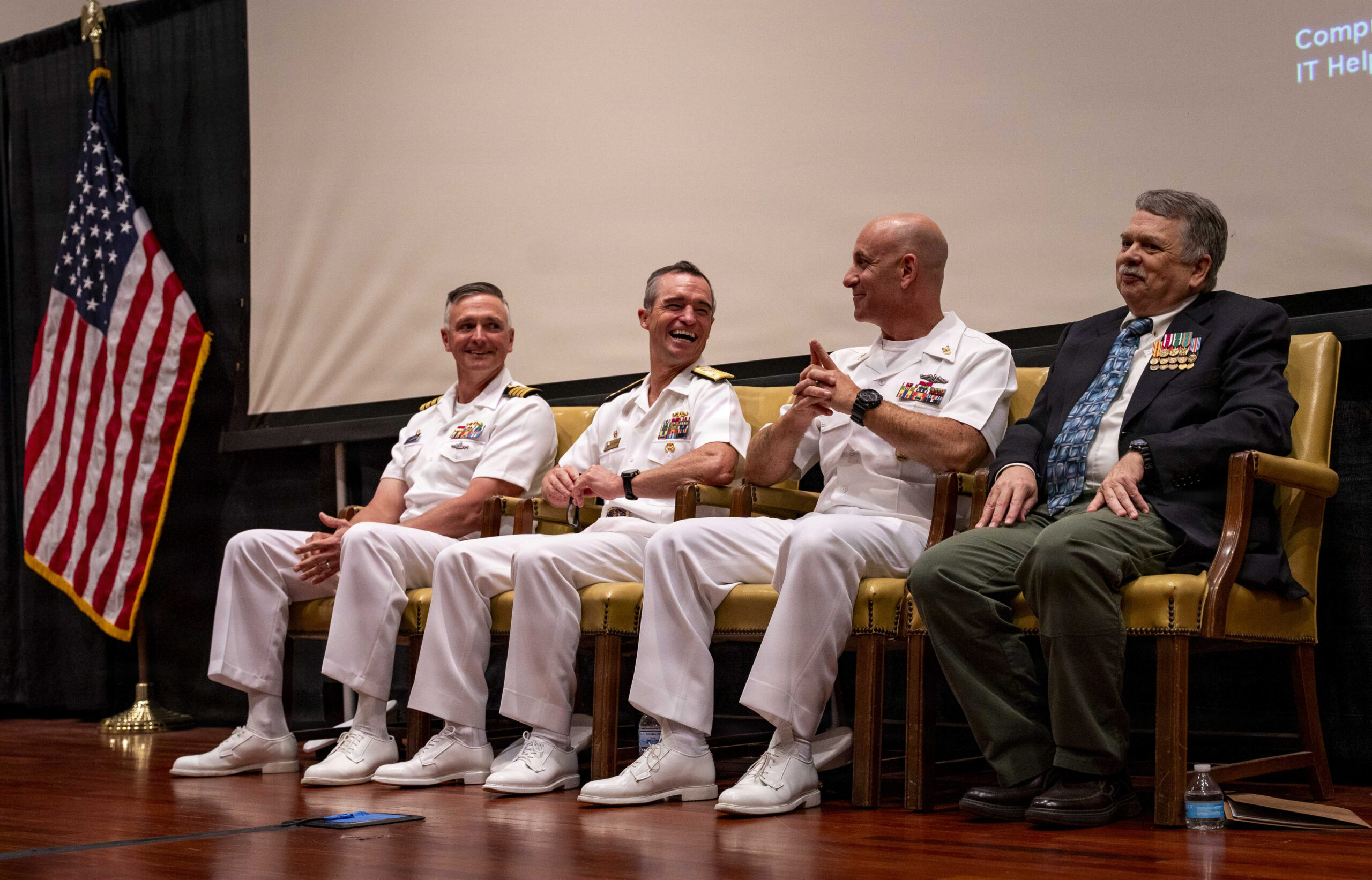 Newly commissioned Navy officers shaking hands after their oath