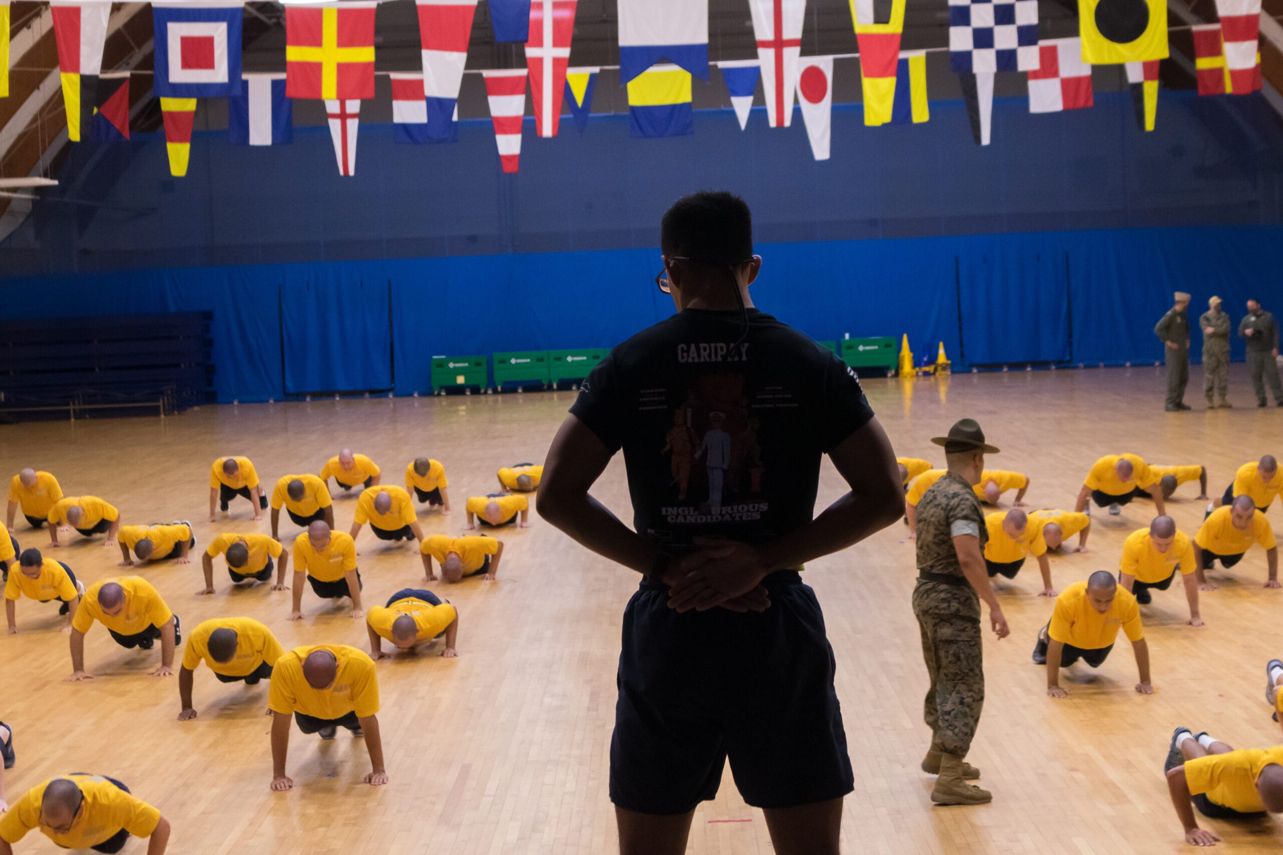Marine drill instructor leading Navy recruits during NROTC NSI