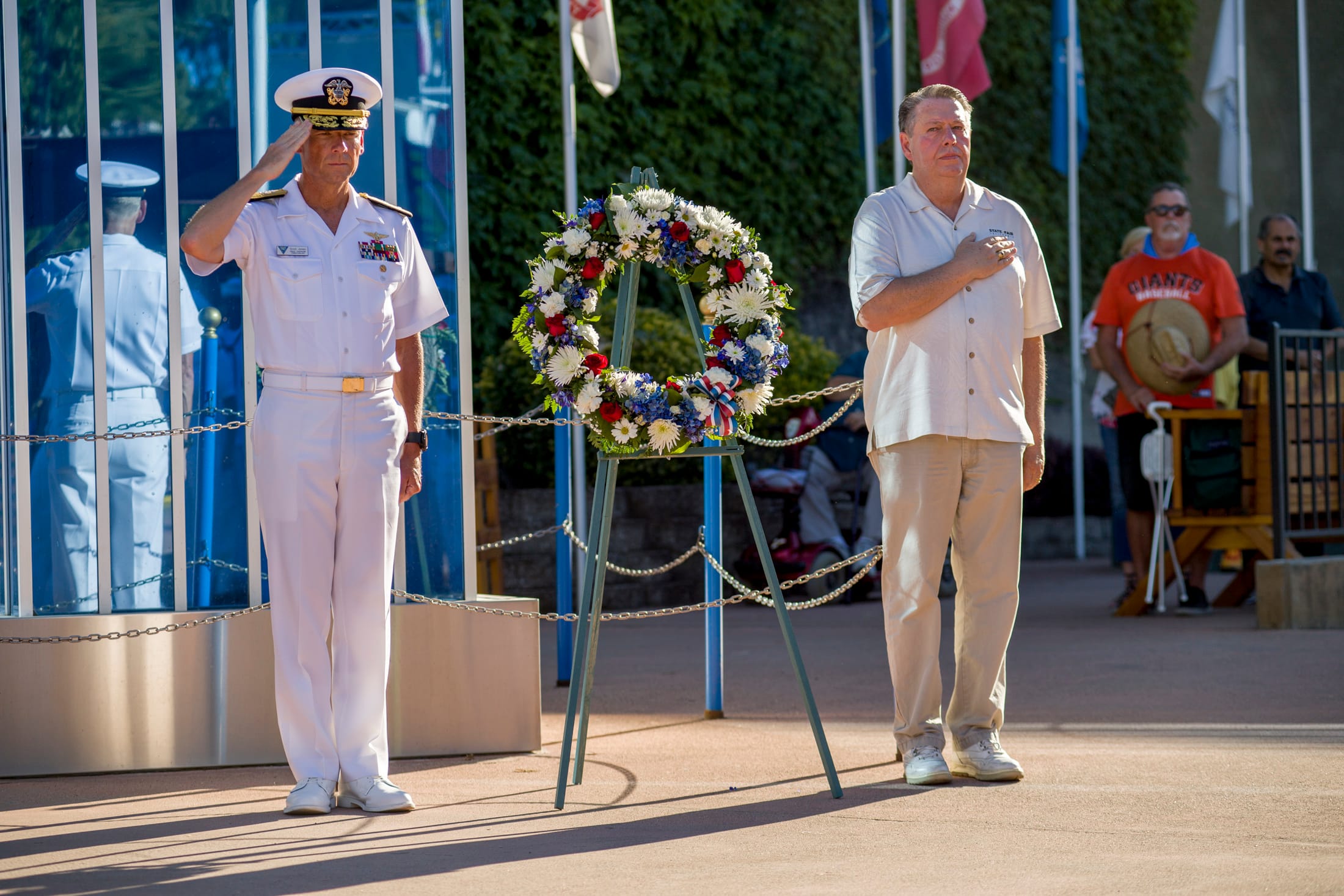 Navy officer in dress whites during commissioning ceremony