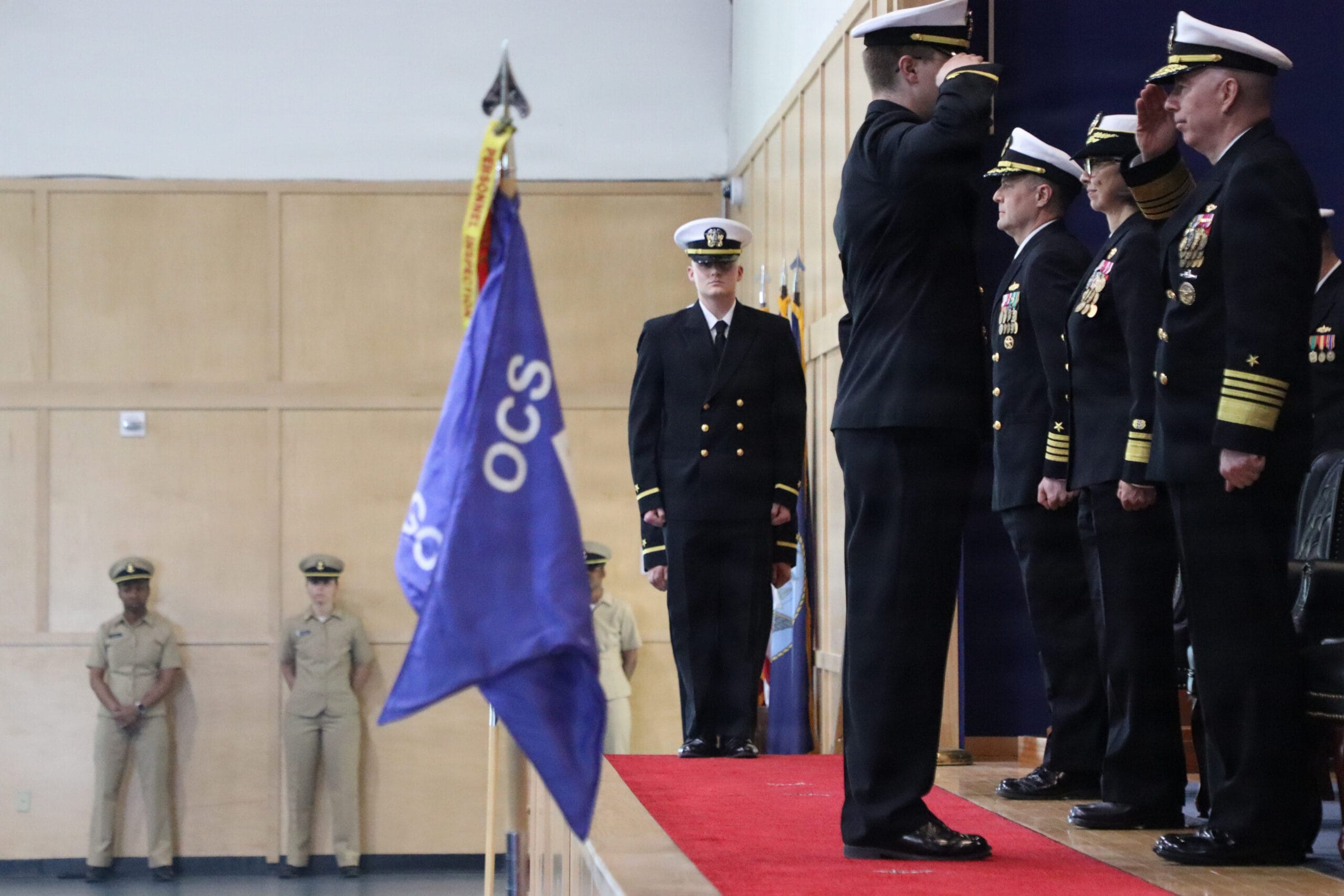 Officer candidates tossing their covers in the air at graduation