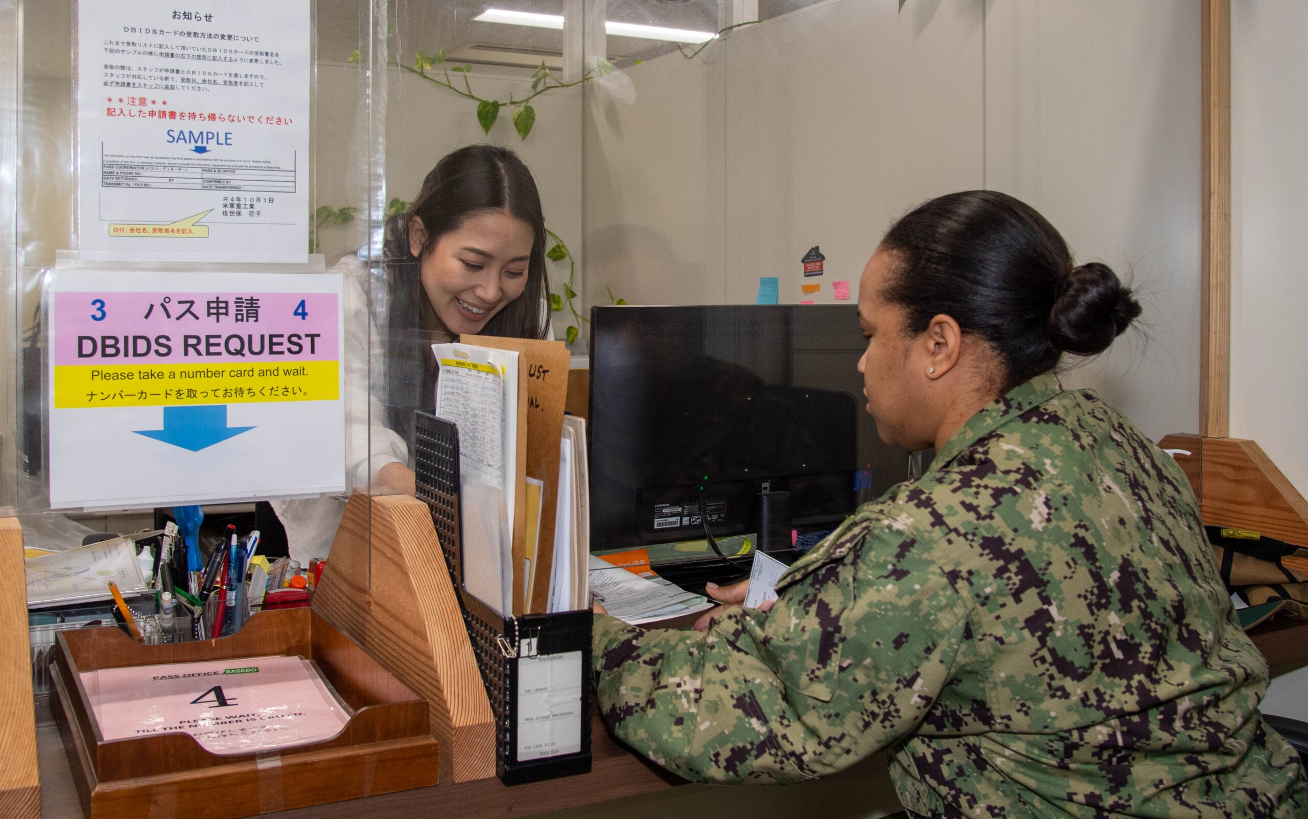 Sailor reviewing pay records on computer