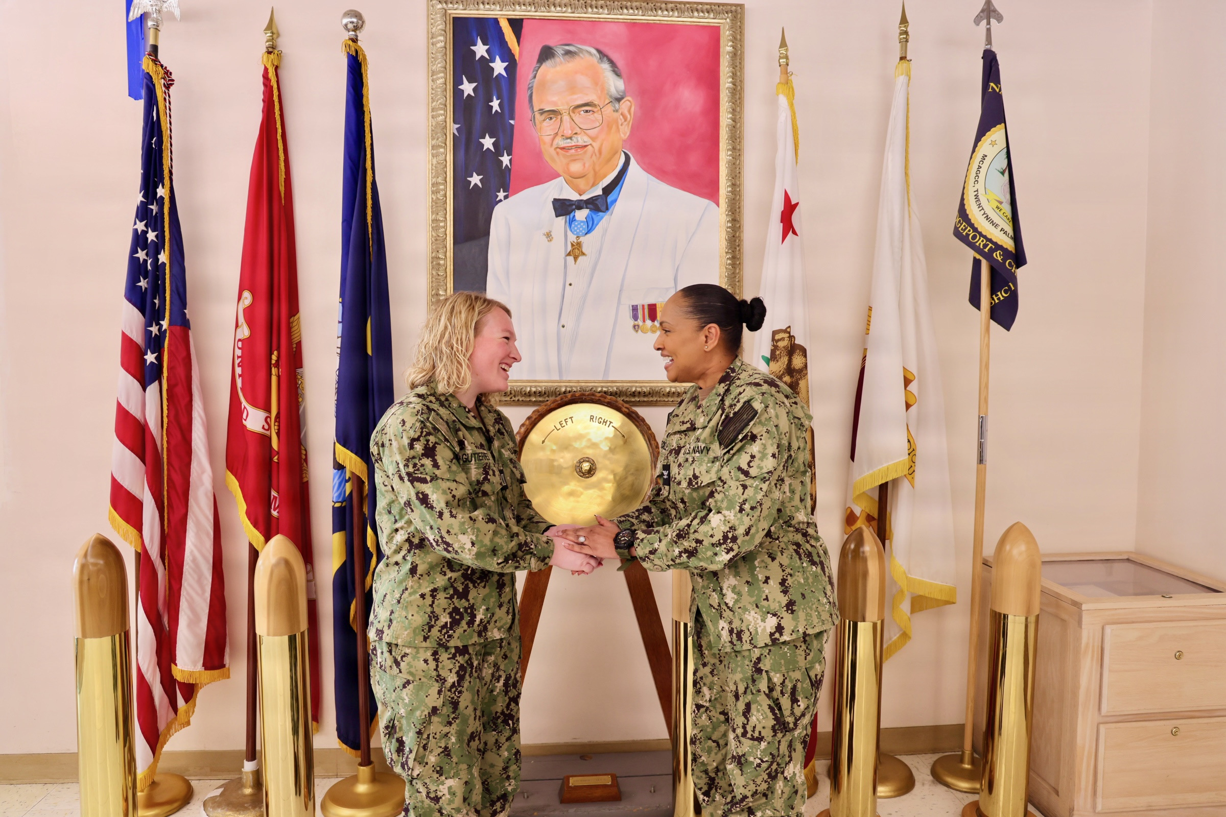 Navy officer in dress uniform, standing confidently