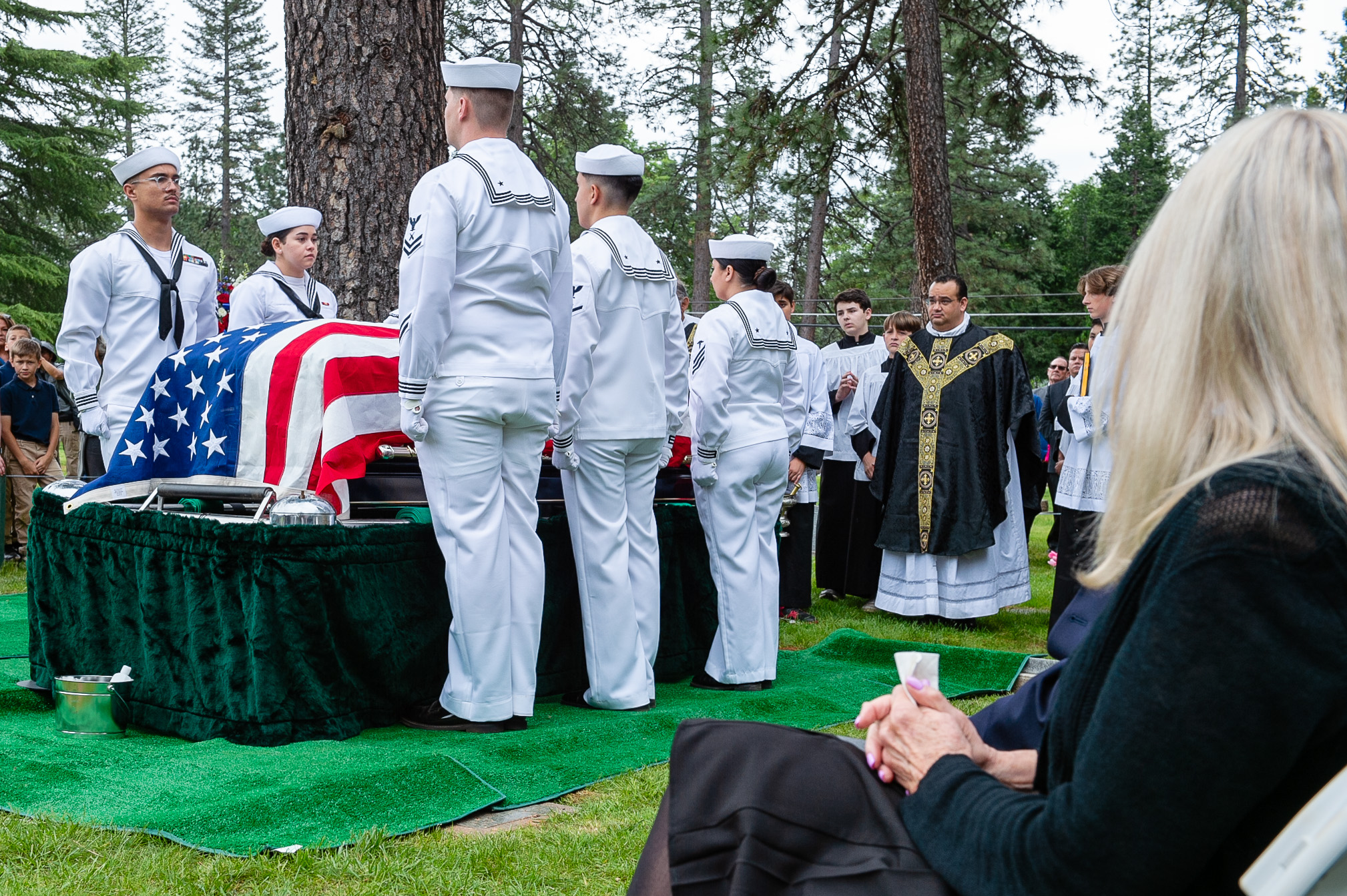 Navy personnel rendering honors at a funeral