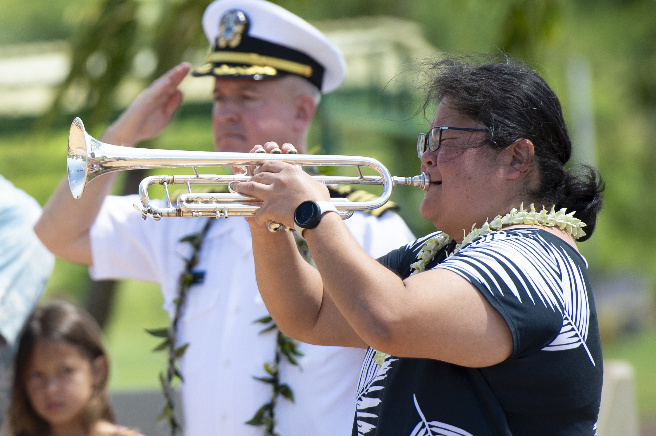 Bugler playing Taps at a national cemetery