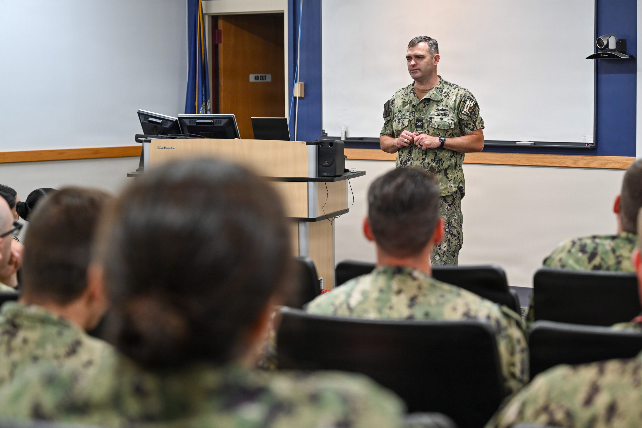 Navy officer mentoring a Sailor
