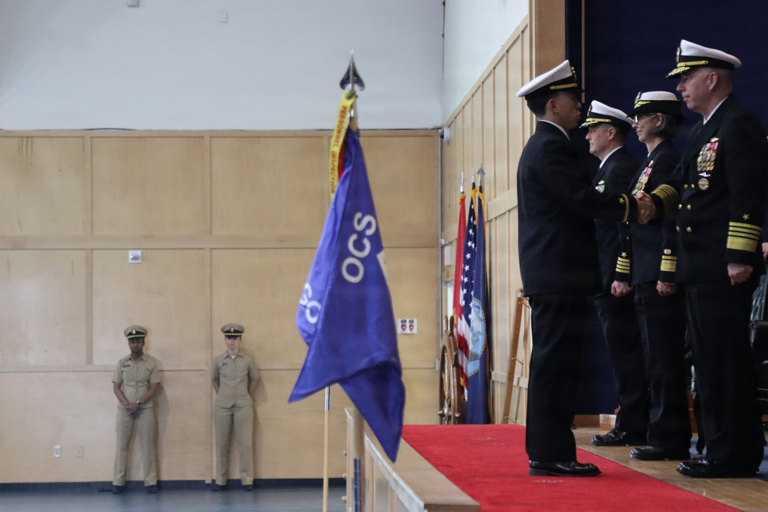 Navy OCS candidates tossing their covers in the air at graduation