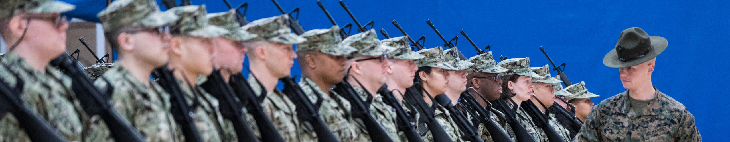 Navy officer candidates standing in formation during drill at Naval Station Newport