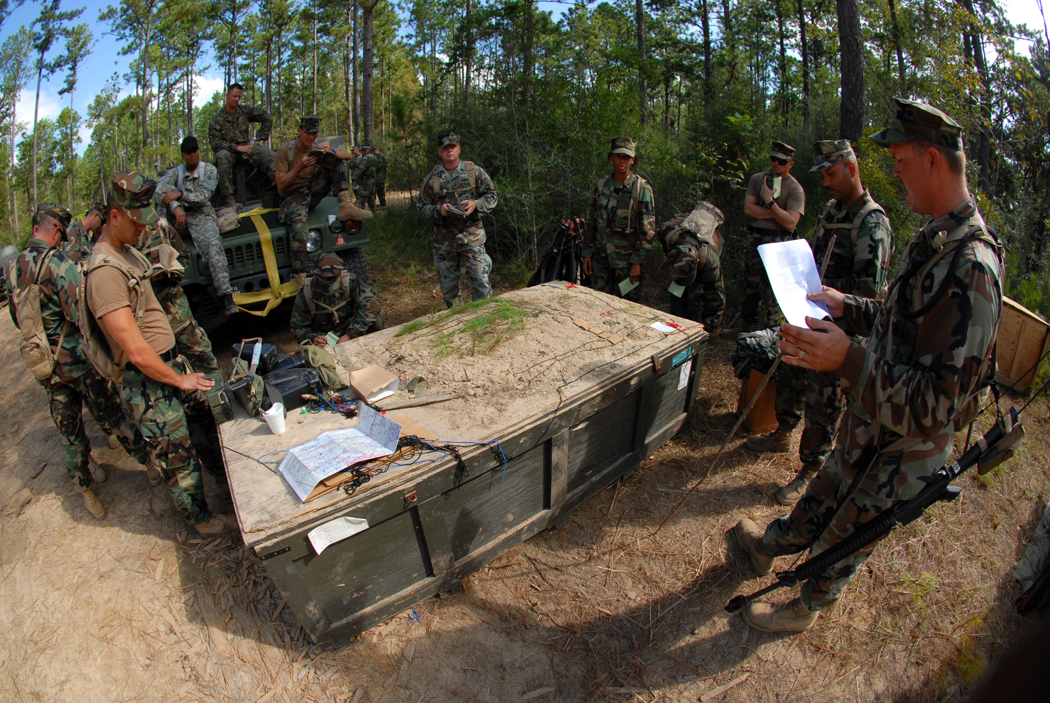 Naval Mobile Construction Battalion 1 Sailors participate in chiefs and officers field exercise