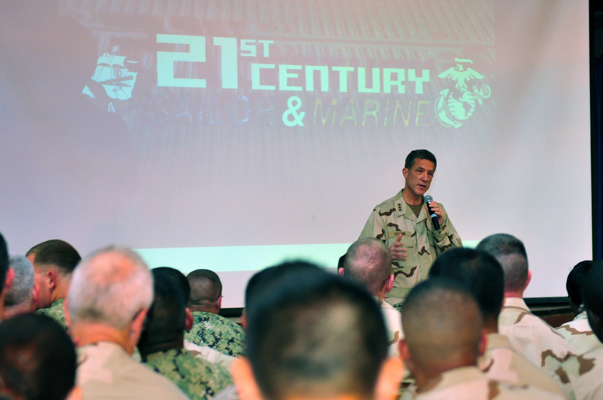 Chief of Navy Reserve Vice Adm. Dirk J. Debbink speaks with Navy and Marine Corps personnel stationed at Camp Lemonnier and tenant commands on the rollout of the 21st Century Sailor and Marine initiative